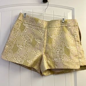Dressy shorts with a hi- lo hem, sparkly gold